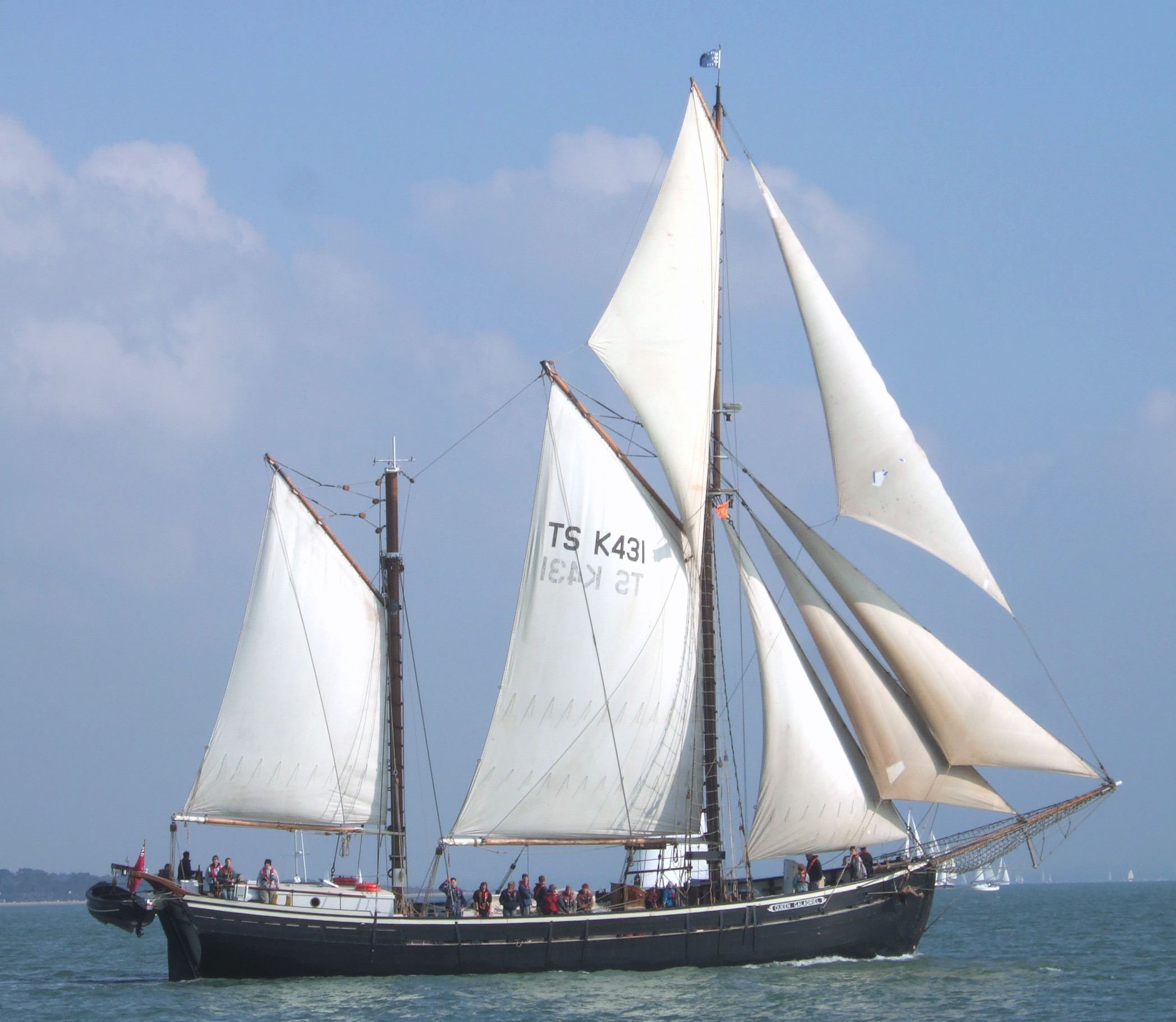 A large sailing boat in full sail.