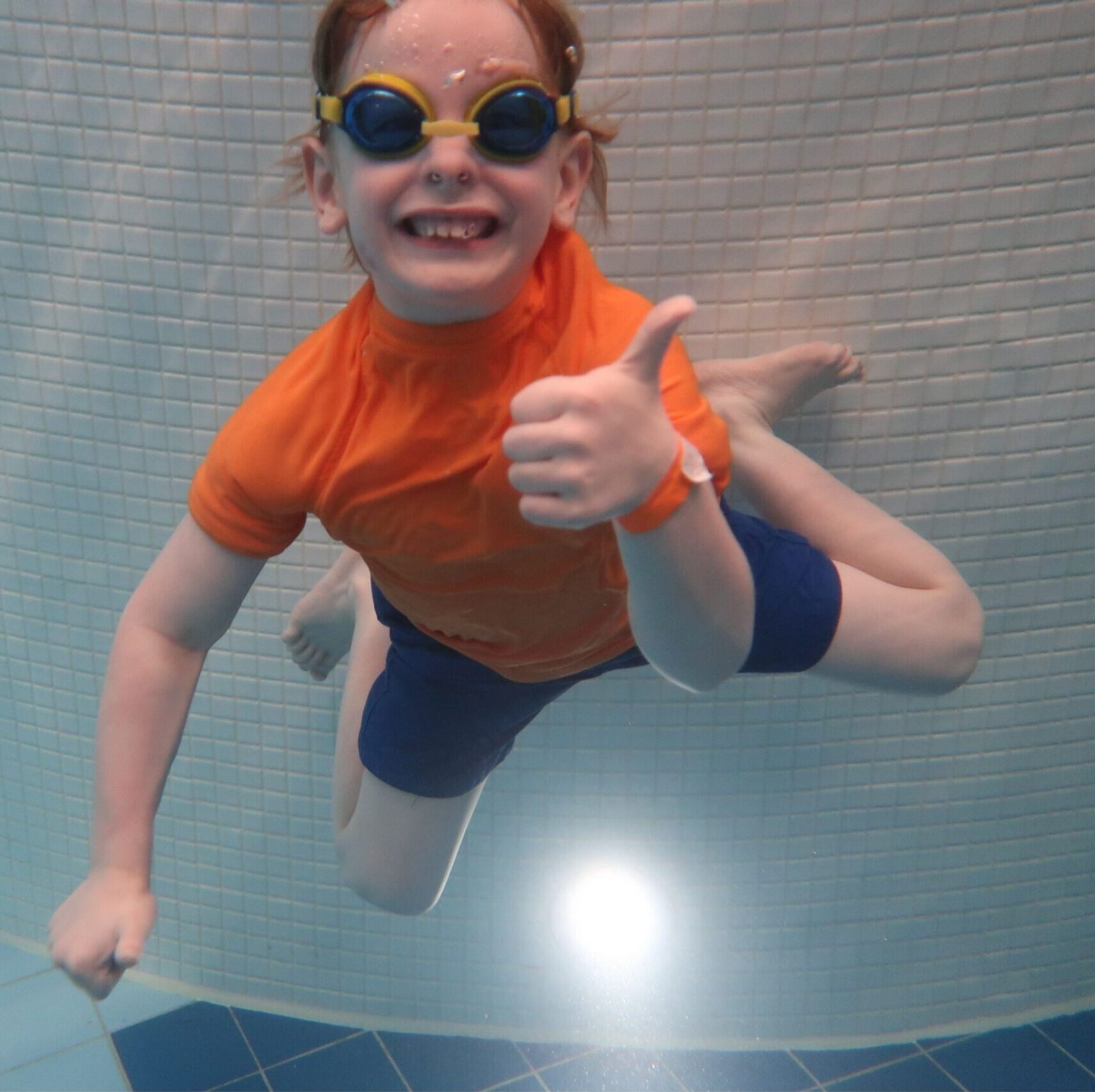 A young boy enjoying swimming at Butlins.