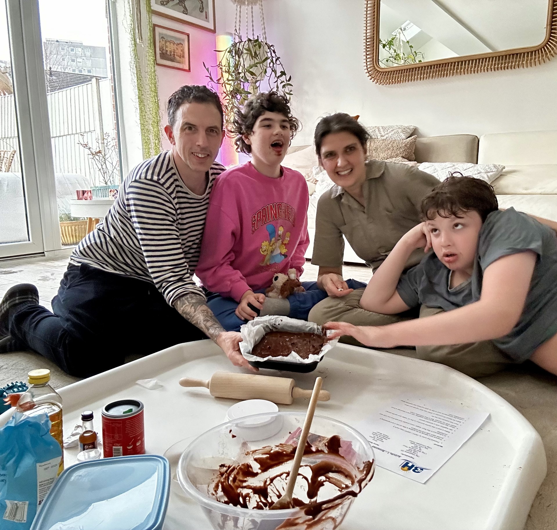A family enjoying a baking activity from the TeensPLUS Challenge.