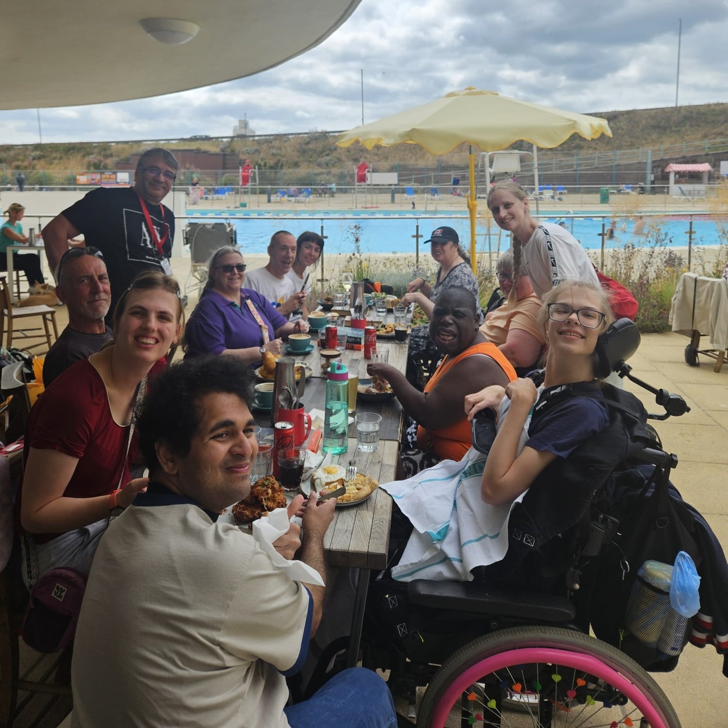 A group of people sitting around a large table eating.
